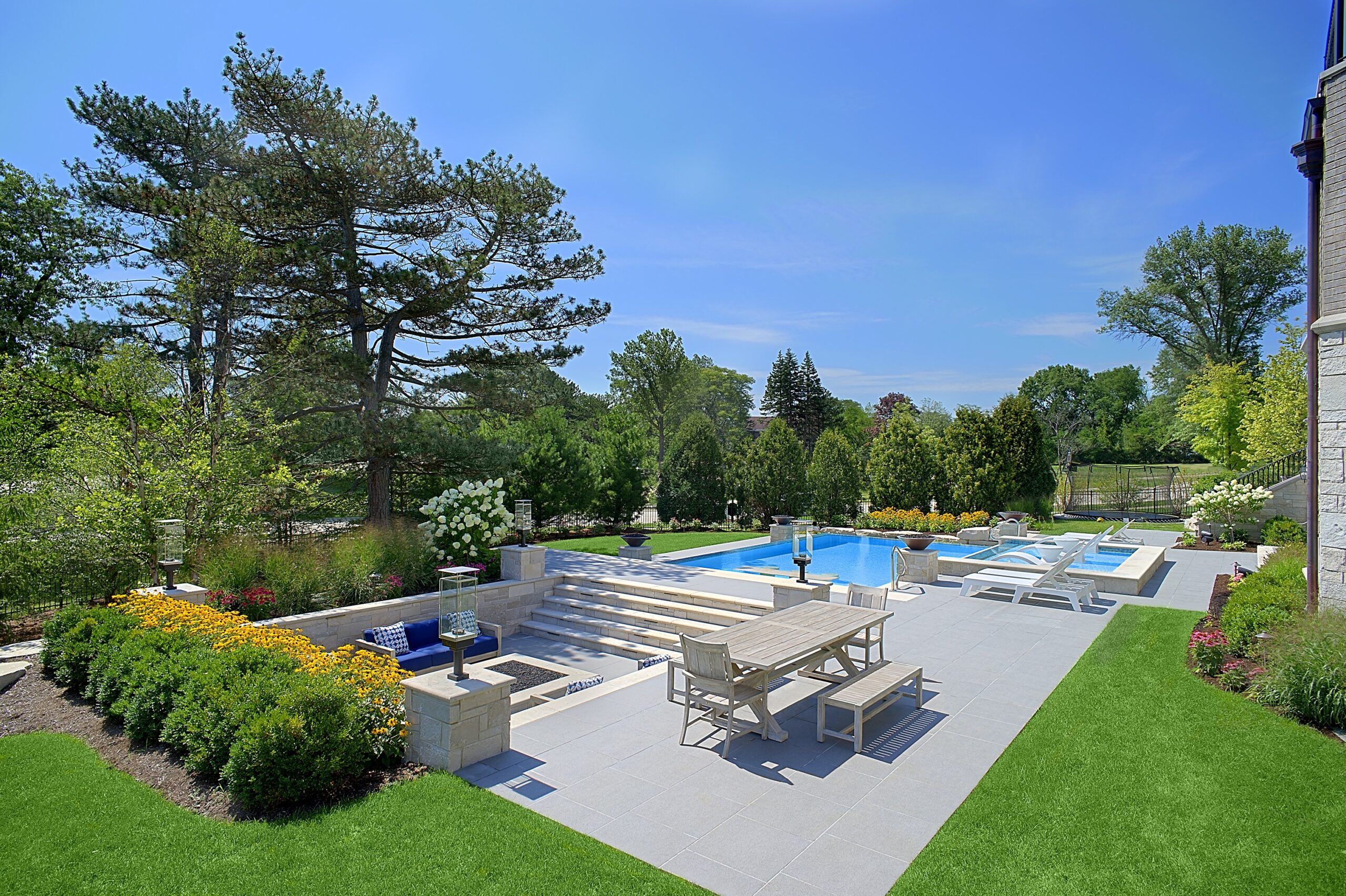 Lush backyard landscape with outdoor living features